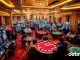 An engaging casino scene showcasing players enjoying debet net betting at poker and roulette tables.